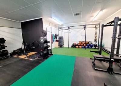 Gym view with weights and fitness equipment