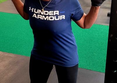 Woman with barbell on shoulders